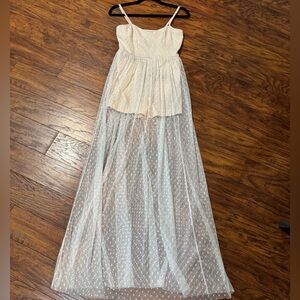New romper with lace overlay.